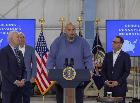 I dont know who these people are. Four men give a presentation.